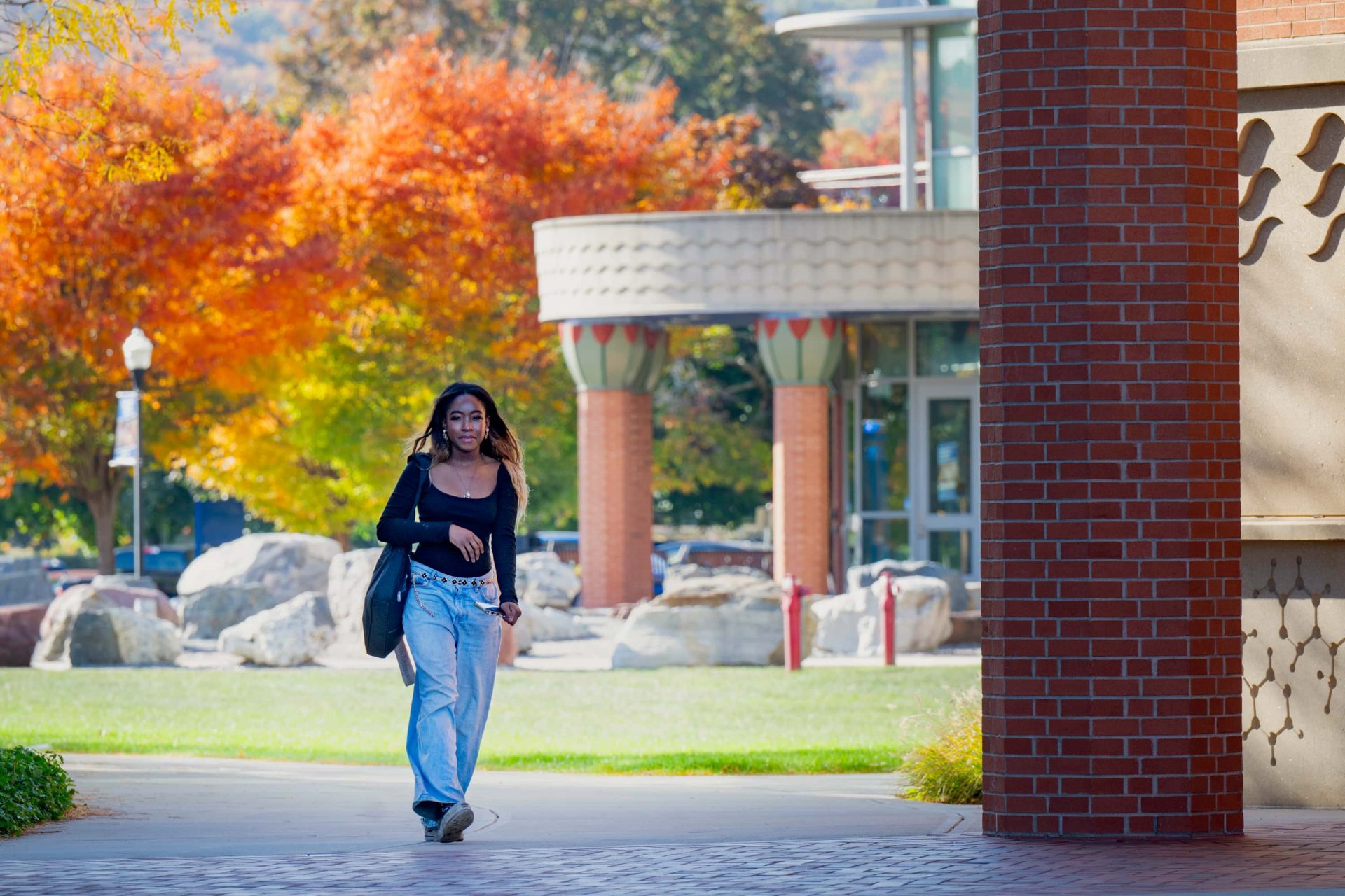 SCSU student walking towards the campus during fall