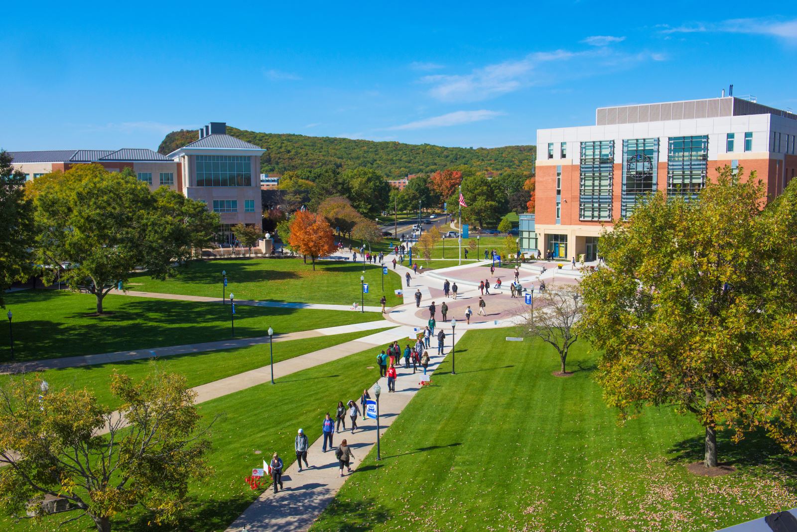 Student and family walking at the campus quad